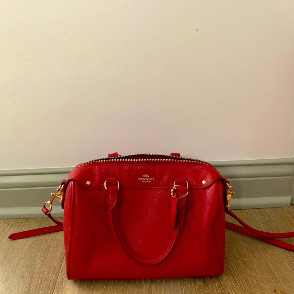 Coach red speedy bag.